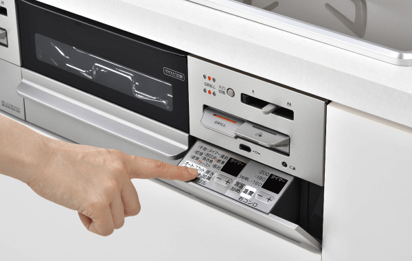 コンロのボタンを押すイメージ